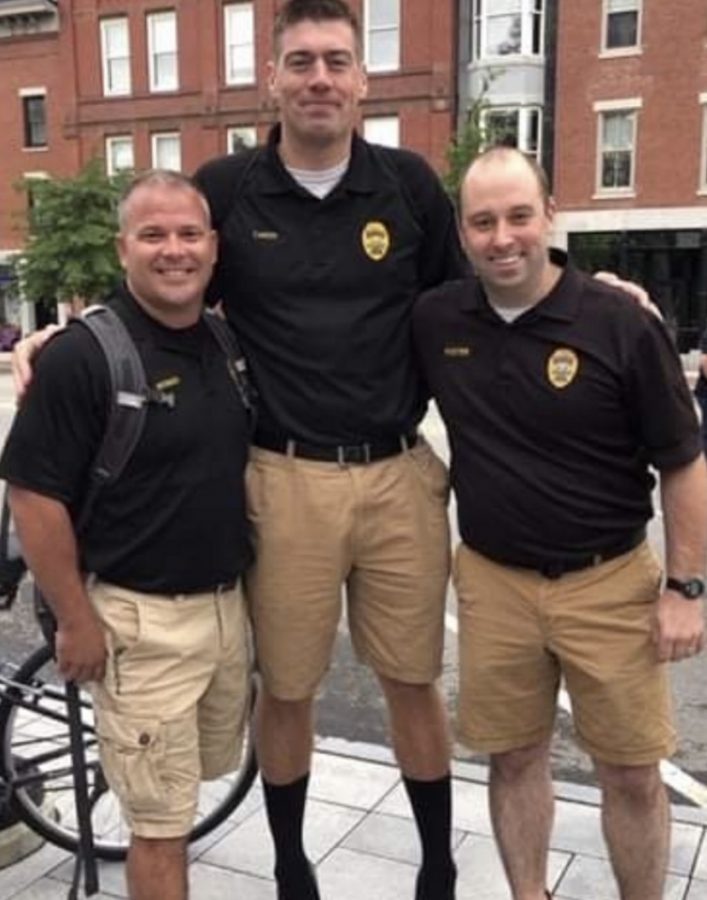 Officer Webber (left) stands with fellow PPD officers.