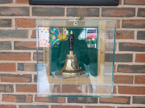 The 2007 High School of Excellence Bell remains in the front lobby (along with Nick Gentes ghostly reflection). 